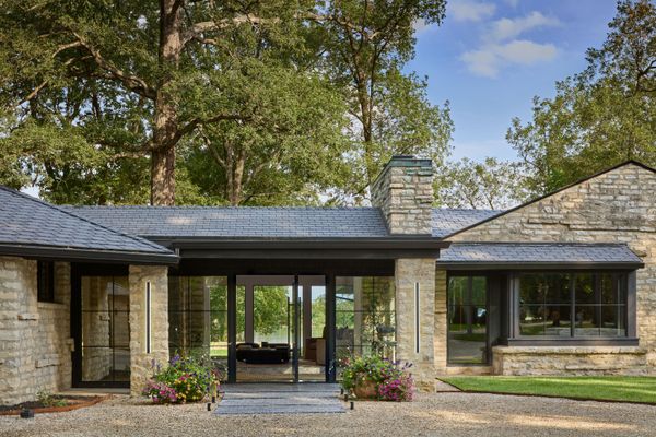 One of the first orders of business was opening up the home with expansive windows and an oversized pivot door by Kolbe Windows &amp; Doors.