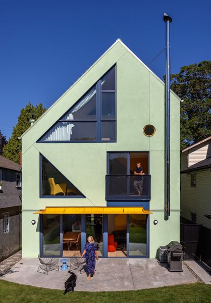 Ali and Adrian Fluevog’s Vancouver house is a series of delightful surprises. Designed by MA+HG Architects, it bursts exuberantly from a narrow lot in an otherwise humdrum neighborhood.