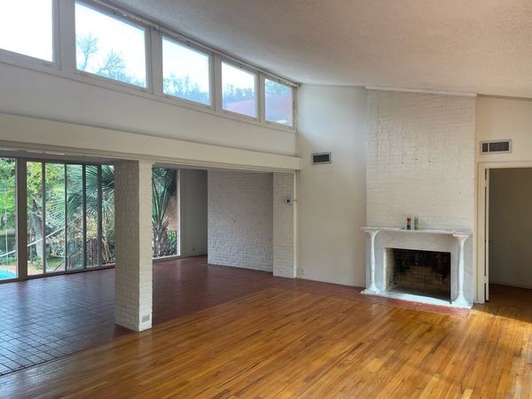 Before: While the original Ford design with extensive windows overlooking the yard remained intact, other changes, like the delicate marble fireplace, looked out of place.