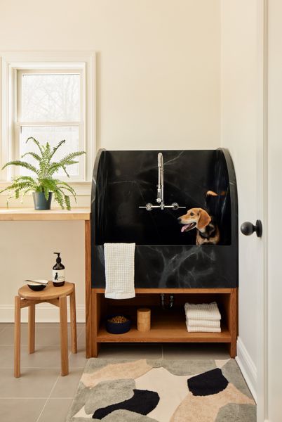 Frederick Tang Architecture also devised a sculptural black soapstone basin for a family and their beloved pooch in an upstate New York farmhouse.