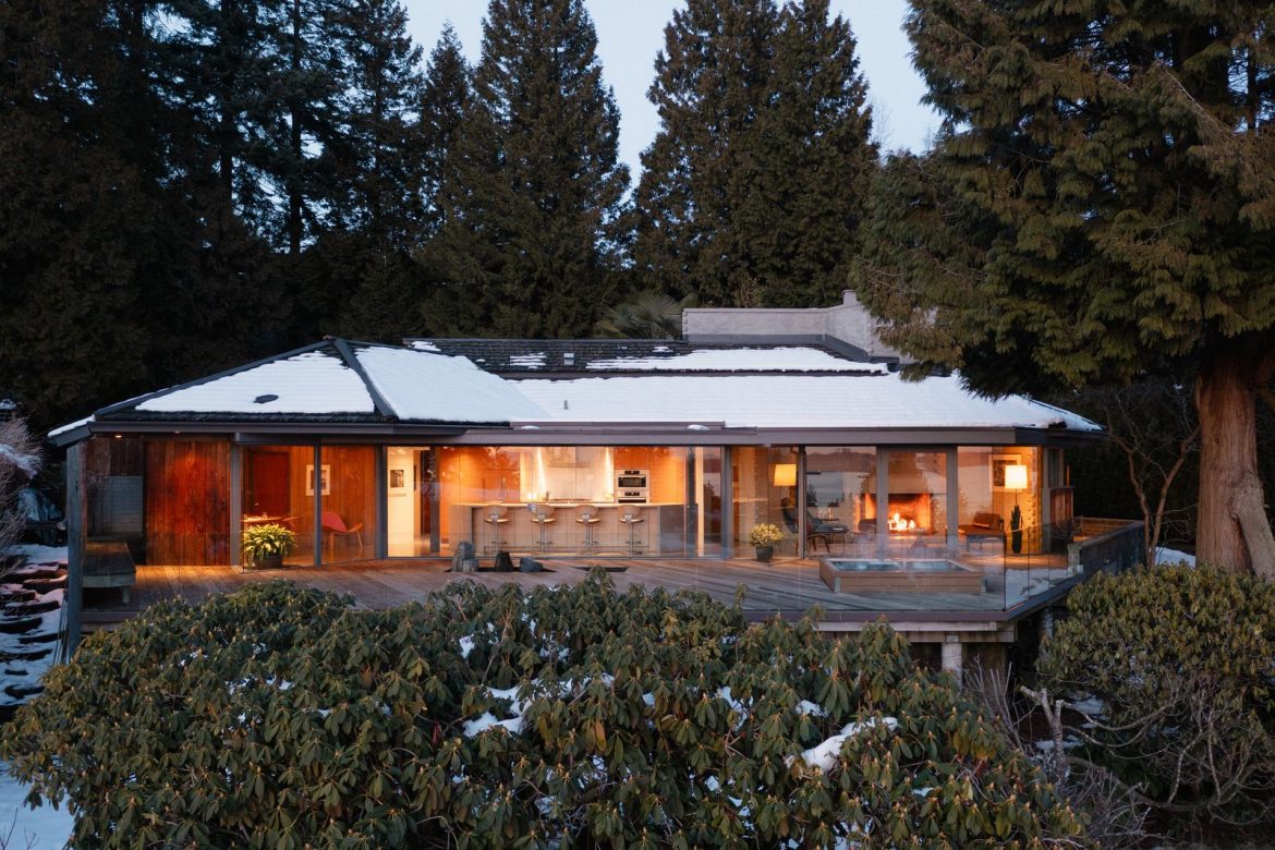 the-midcentury-home-has-an-unusual-geometric-plan-a-suite-of-built-in-furniture-and-a-monolithic-concrete-fireplace.jpg