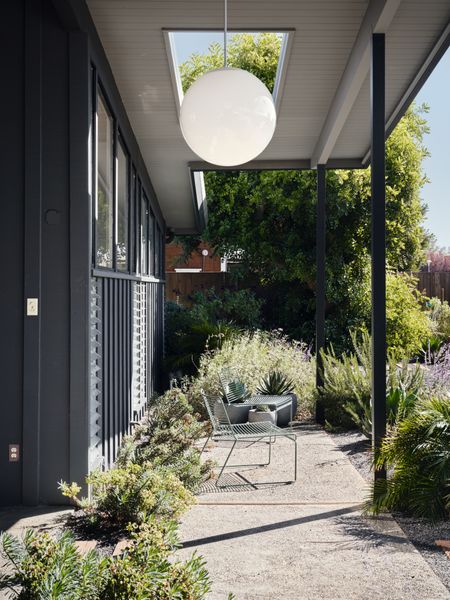 The porch's lamp was repurposed from a mid-century church in Wisconsin, despite being manufactured across the bay in Berkeley in the 50s.