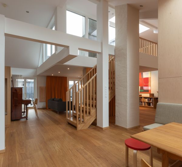 The staircase is the central feature of the open-plan duplex apartment.